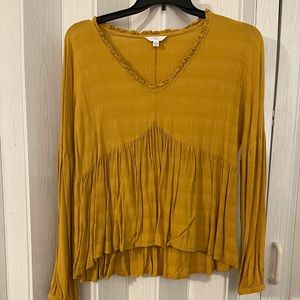 Mustard colored top. Size Large